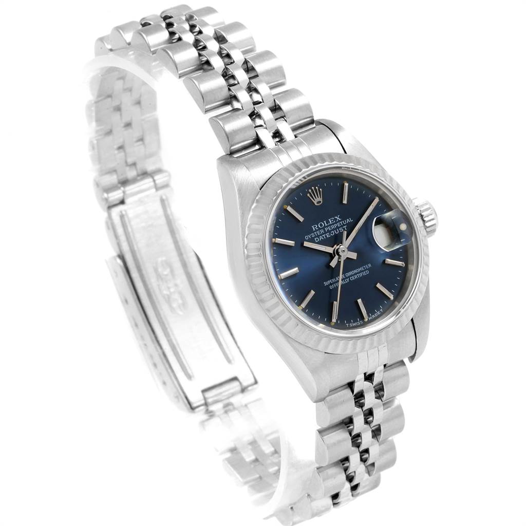 The Rolex Datejust 69174 Women
s Stainless Steel Blue Dial 69174 Women
s Stainless Steel Blue Dial watch is shown at an angle highlighting the case, dial, fluted bezel, and jubilee bracelet.