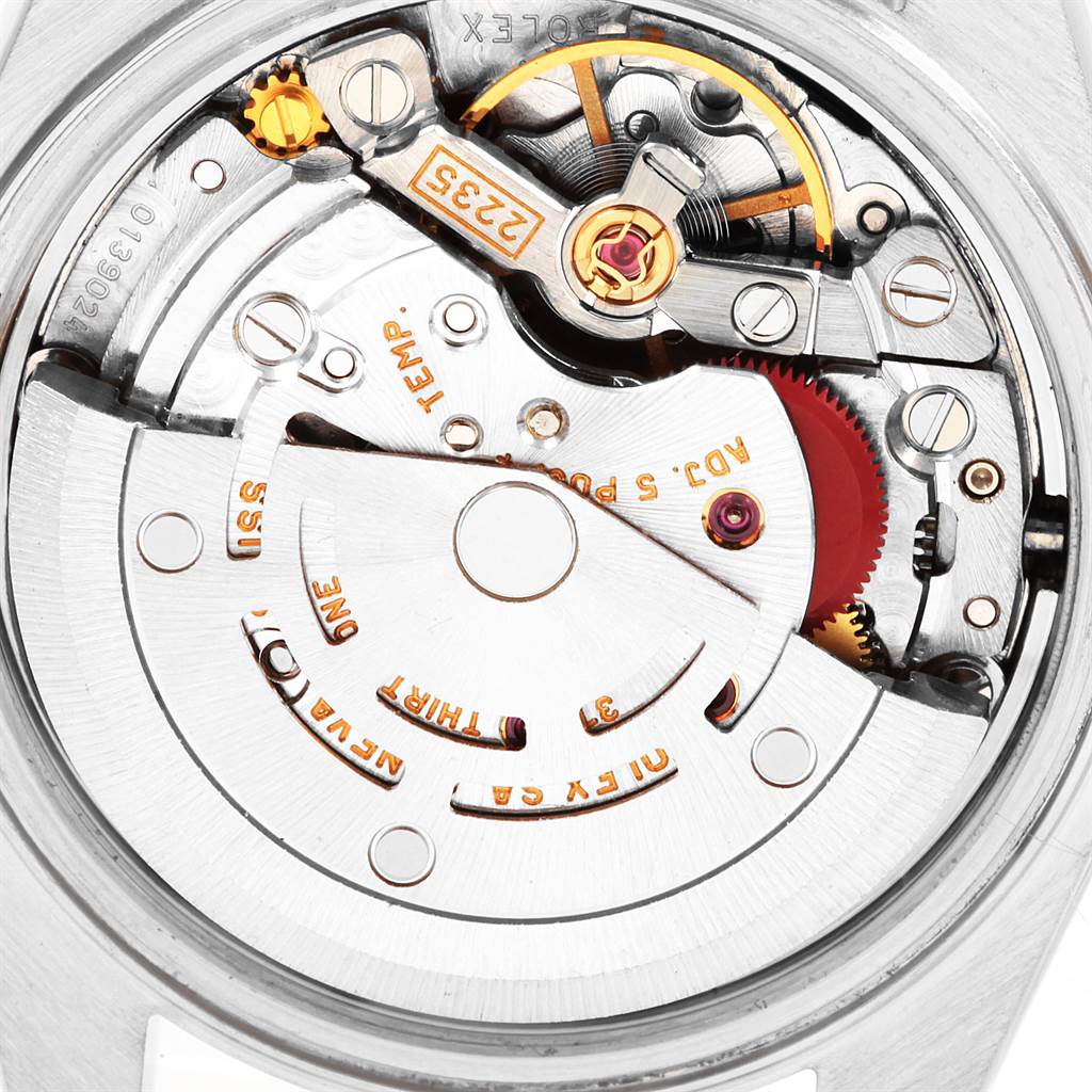 This image shows the intricate interior mechanism of a Rolex Datejust 79173 Women's Stainless Steel Champagne Dial 79173 Women's Stainless Steel Champagne Dial watch, focusing on the movement and gears.