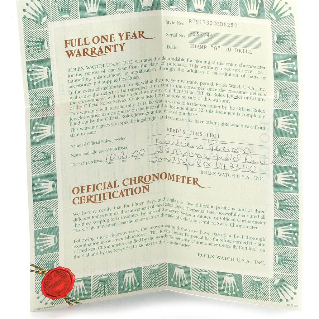 The image shows a certificate and warranty card for the Rolex Datejust 79173 Women's Stainless Steel Champagne Dial 79173 Women's Stainless Steel Champagne Dial model, captured from a top-down angle.