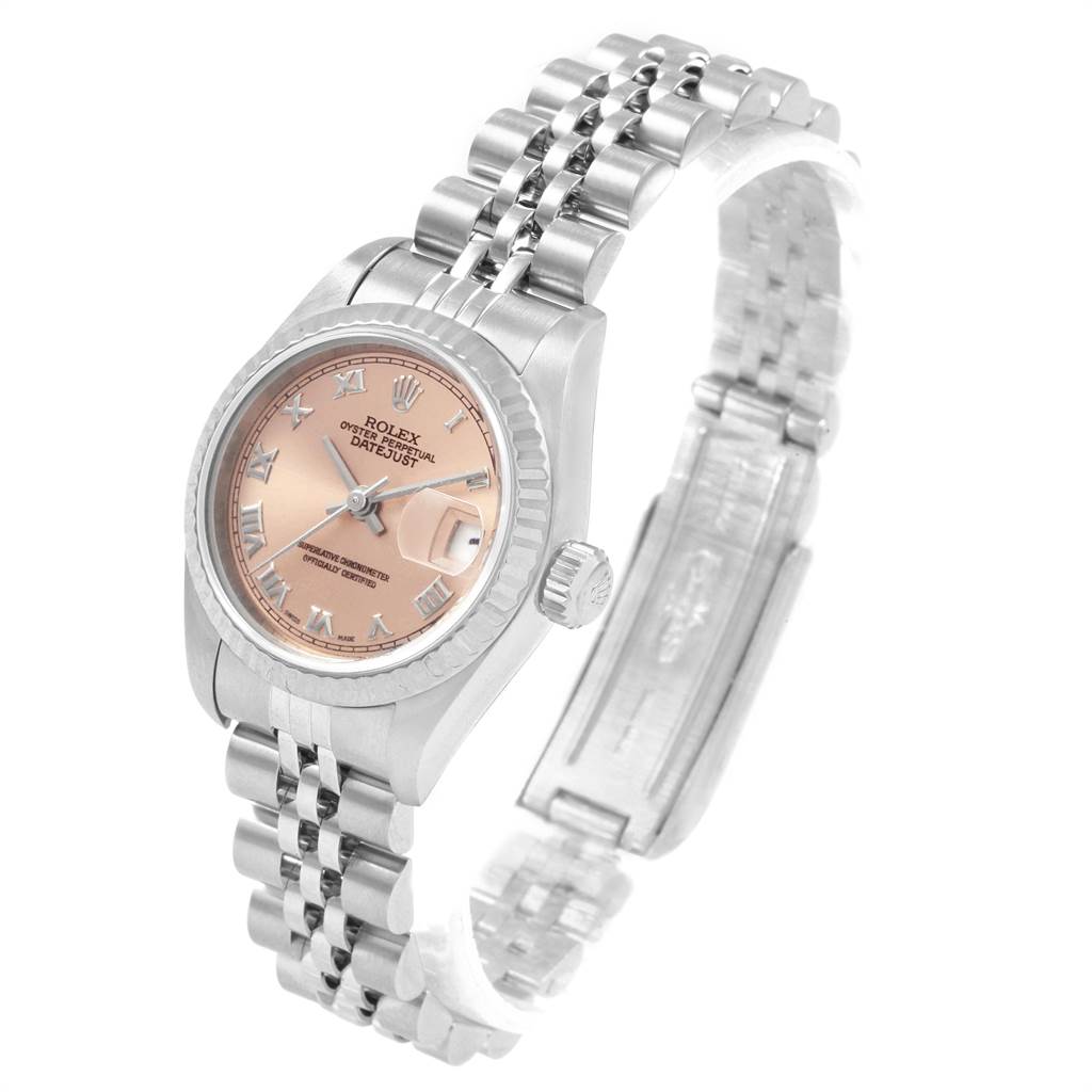 The Rolex Datejust 79174 Women
s Stainless Steel Pink Dial 79174 Women
s Stainless Steel Pink Dial watch is shown at a three-quarter angle, displaying its face, bezel, and half of its bracelet.