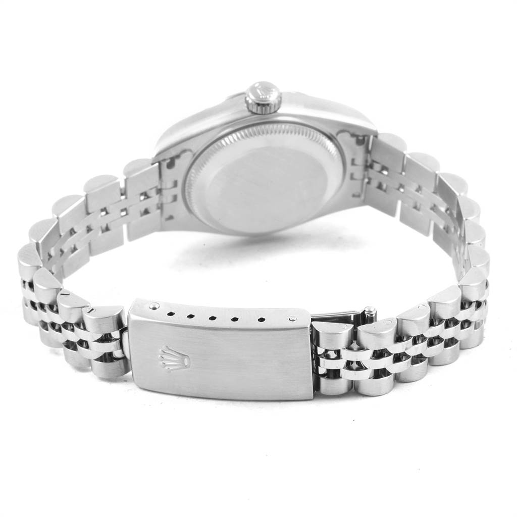 The image depicts the back view of a Rolex Datejust 79174 Women
s Stainless Steel Pink Dial 79174 Women
s Stainless Steel Pink Dial watch, focusing on the case back and bracelet clasp.