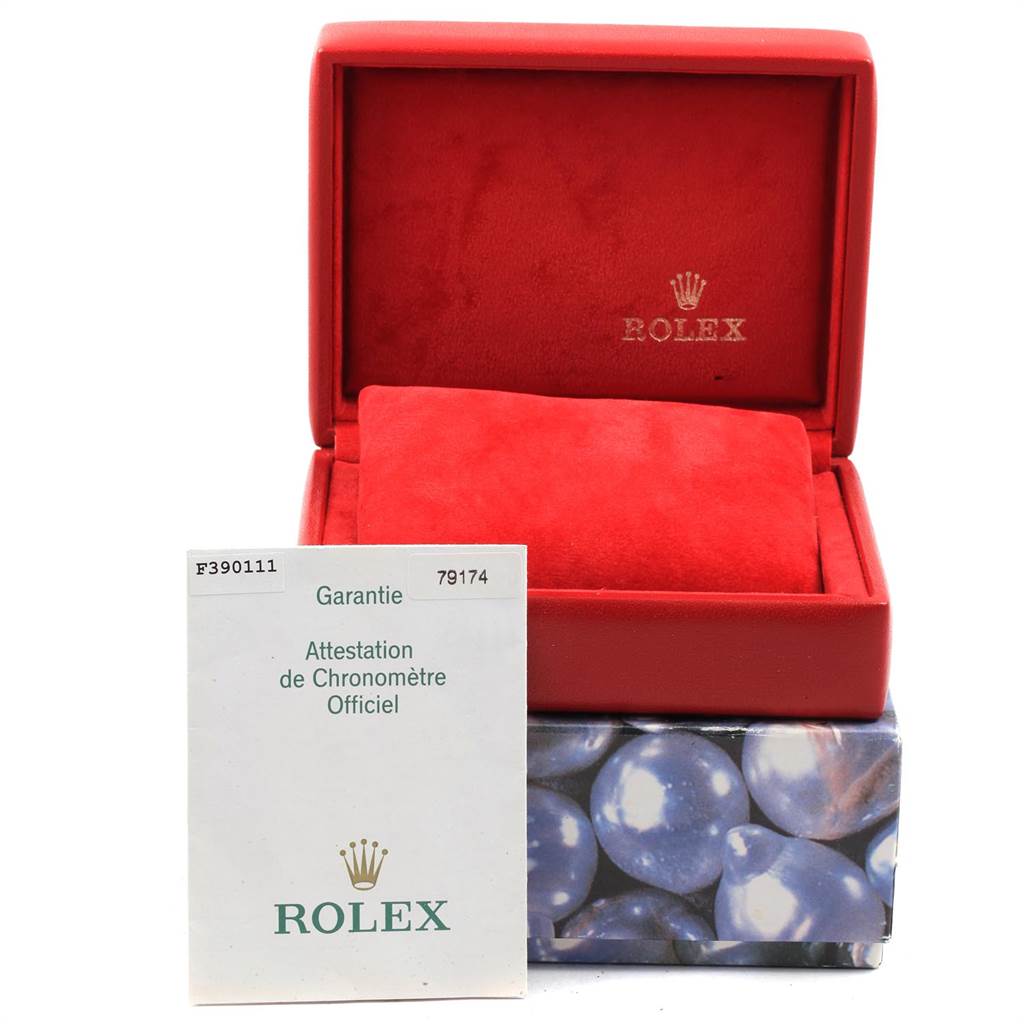 The image shows the open box and warranty card for a Rolex Datejust 79174 Women
s Stainless Steel Pink Dial 79174 Women
s Stainless Steel Pink Dial watch, with the box in a red lining.