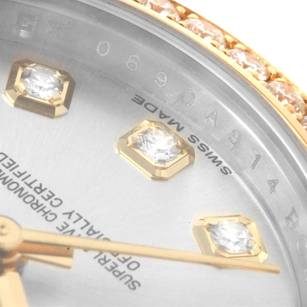 This close-up image of the Rolex Datejust 179383 Women
s Steel and Gold (two tone) Silver Dial 179383 Women
s Steel and Gold (two tone) Silver Dial model shows the dial with diamond hour markers and the bezel with diamond accents.