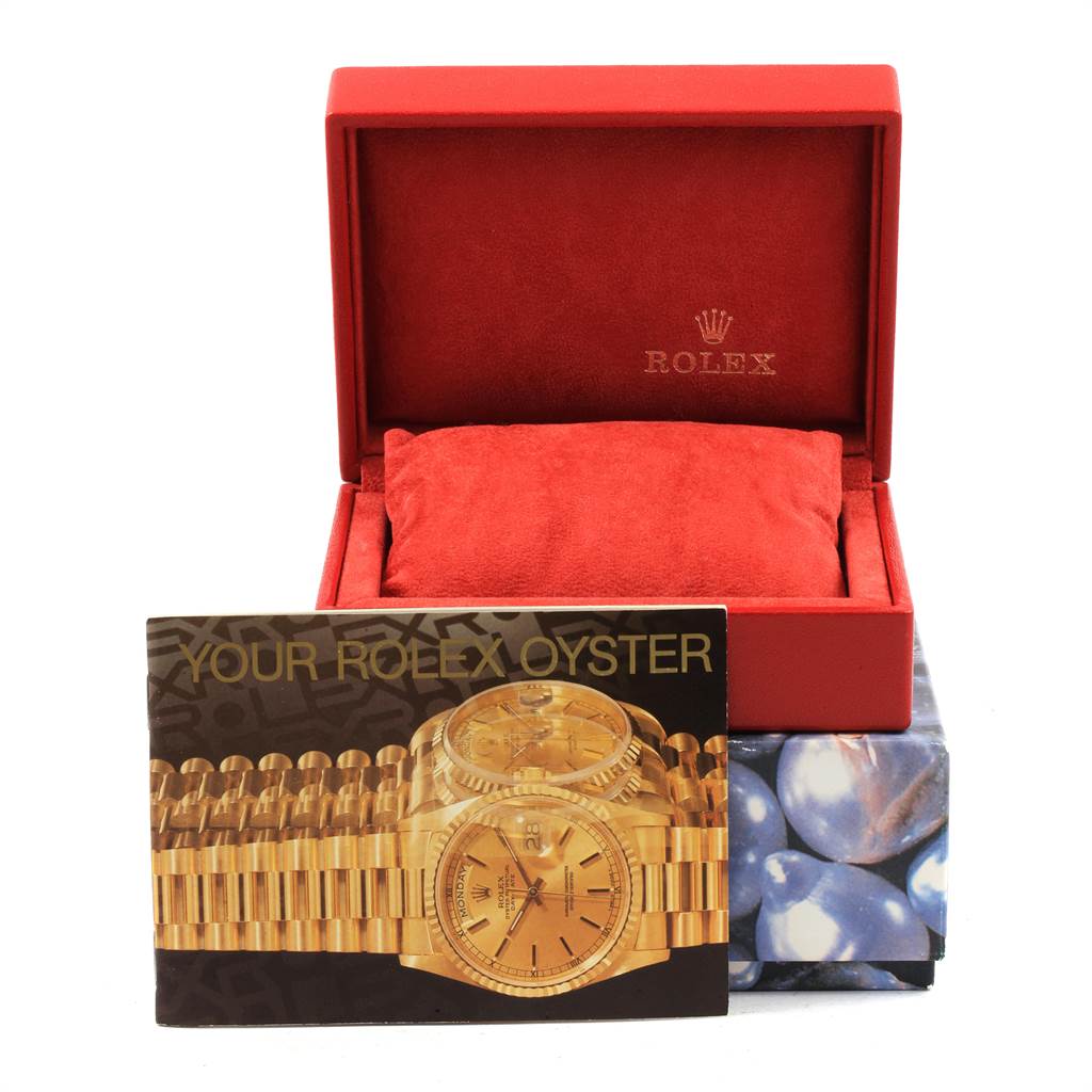 This image shows an open Rolex Datejust 79173 Women's Steel and Gold (two tone) White Dial 79173 Women's Steel and Gold (two tone) White Dial watch box, a cushion, and an "Your Rolex Oyster" booklet.