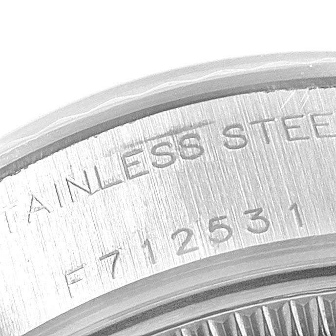This close-up image shows the stainless steel case back with serial number of a Rolex Datejust 79174 Women
s Stainless Steel Silver Dial 79174 Women
s Stainless Steel Silver Dial watch.