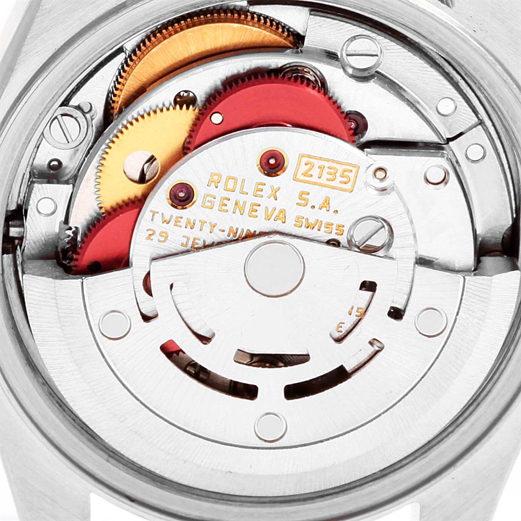 This image shows the internal movement components of the Rolex Datejust 69174 Women
s Stainless Steel Silver Dial 69174 Women
s Stainless Steel Silver Dial watch, including gears and the rotor.