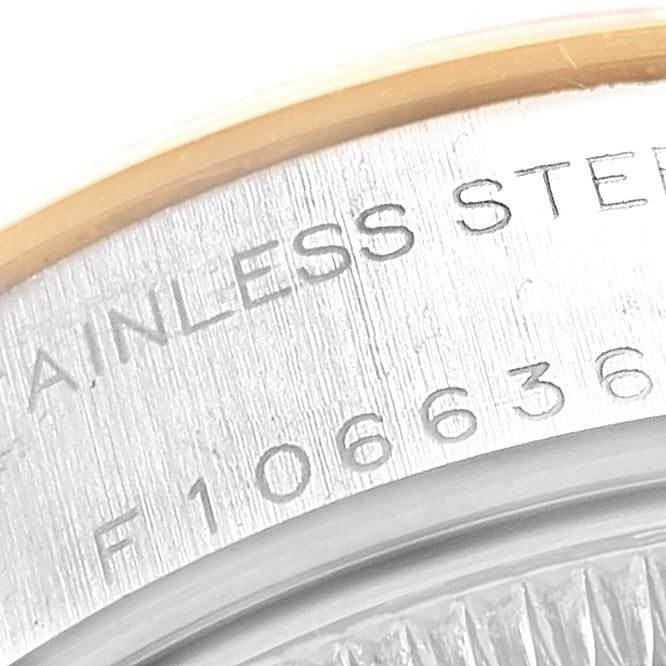 This close-up image of the Rolex Datejust 79163 Women's Steel and Gold (two tone) White Dial 79163 Women's Steel and Gold (two tone) White Dial watch shows the engraved text on its stainless steel case back.