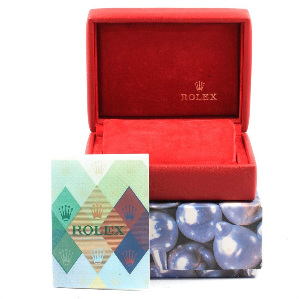 The image shows a red Rolex Datejust 79163 Women's Steel and Gold (two tone) White Dial 79163 Women's Steel and Gold (two tone) White Dial watch box, an interior cushion, and an accompanying manual booklet.