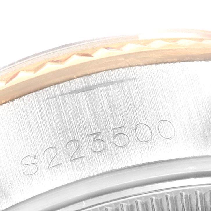 This close-up image shows the serial number engraved on the side of a Rolex Datejust 69173 Women's Stainless Steel Grey Dial 69173 Women's Stainless Steel Grey Dial watch case.
