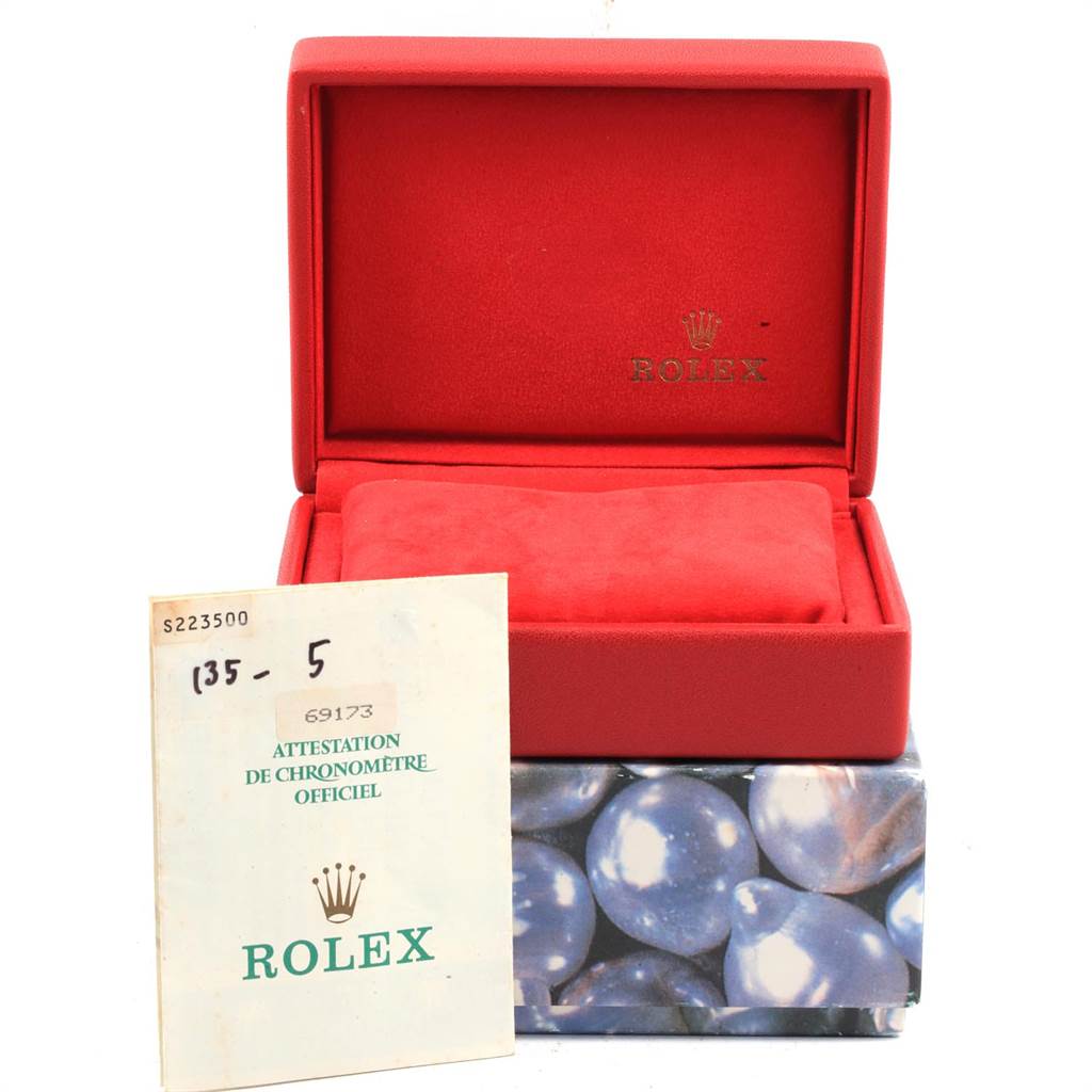 The image shows an open red Rolex box and official documentation for a Datejust model by Rolex.