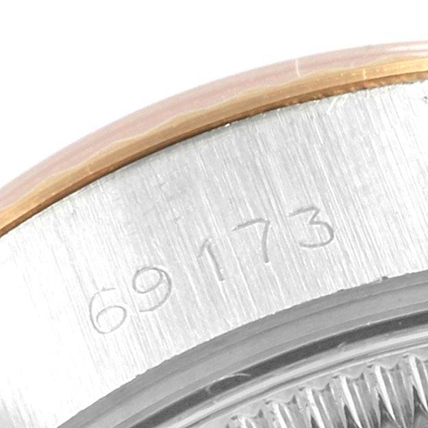 This image shows a close-up of the edge of a Rolex Datejust 69173 Women
s Stainless Steel Blue Dial 69173 Women
s Stainless Steel Blue Dial model 69173, focusing on the reference number engraving.