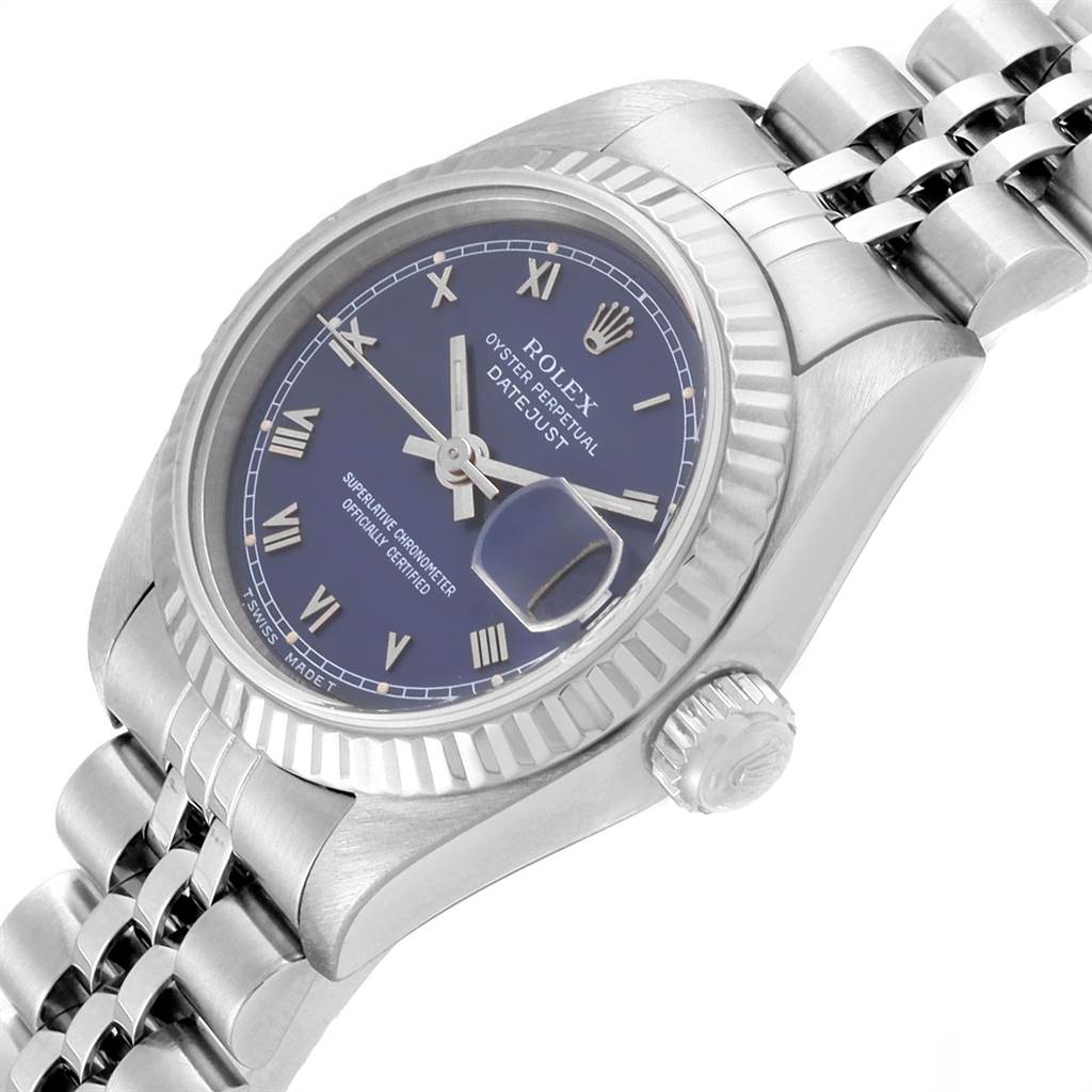 The image shows a Rolex Datejust 69174 Women
s Stainless Steel Blue Dial 69174 Women
s Stainless Steel Blue Dial watch from an oblique angle, highlighting the dial, fluted bezel, crown, and part of the bracelet.