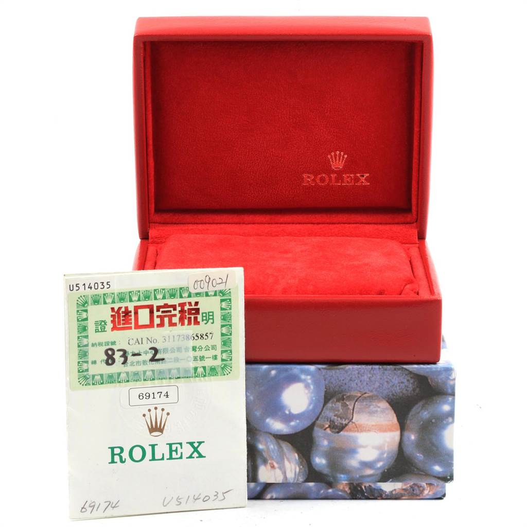 This image shows an empty watch box and paper insert for a Rolex Datejust 69174 Women
s Stainless Steel Blue Dial 69174 Women
s Stainless Steel Blue Dial model, with the box open and insert partially visible.