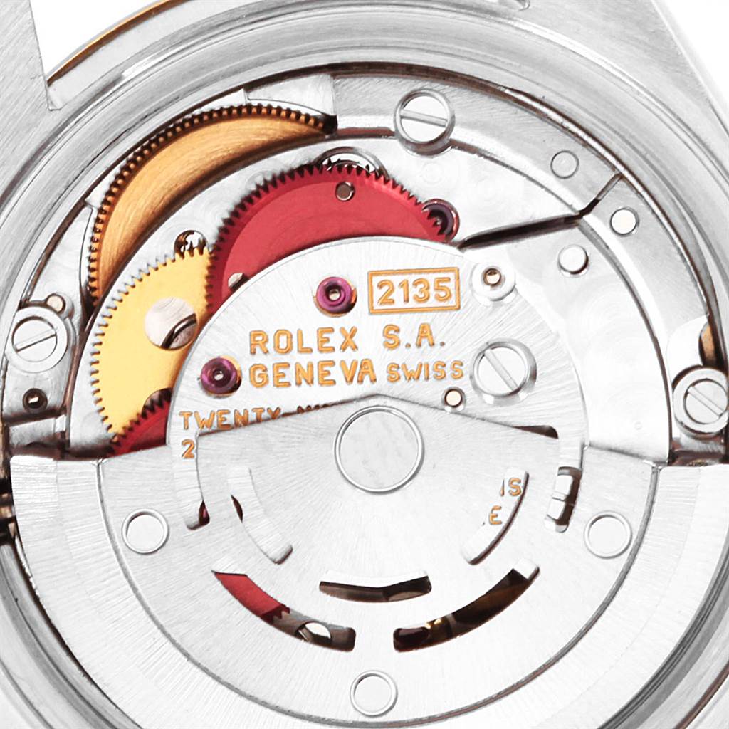 This image shows a close-up of the internal mechanism of a Rolex Datejust 69173 Women
s Stainless Steel Beige Dial 69173 Women
s Stainless Steel Beige Dial watch, highlighting the gears and movement components.