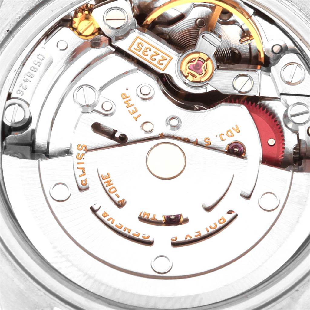 This is a close-up view of the movement mechanism of a Rolex Datejust 79174 Women
s Stainless Steel Silver Dial 79174 Women
s Stainless Steel Silver Dial watch showing the intricacies of its internal components.