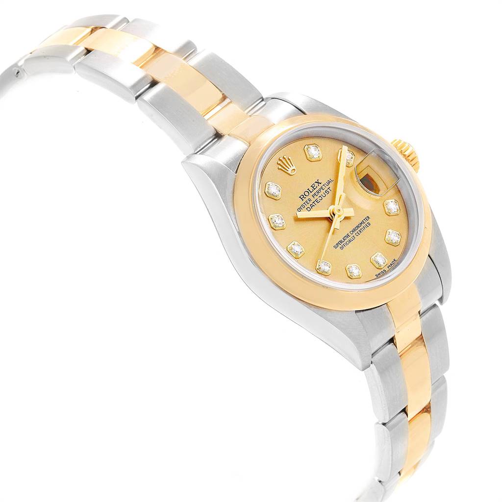 The Rolex Datejust 79163 Women's Steel and Gold (two tone) Champagne Dial 79163 Women's Steel and Gold (two tone) Champagne Dial watch is shown from a side angle featuring its bracelet, case, and dial with diamond hour markers.