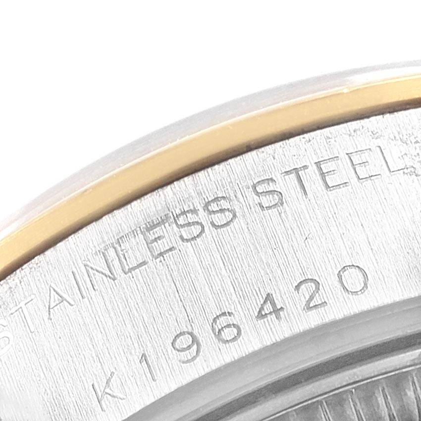 This is a close-up angle of a Rolex Datejust 79163 Women's Steel and Gold (two tone) Champagne Dial 79163 Women's Steel and Gold (two tone) Champagne Dial, showing part of the stainless steel case back with its engraved details.