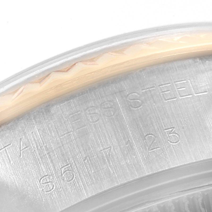 The image shows a close-up of the case back edge of a Rolex Datejust 69173 Women's Stainless Steel Beige Dial 69173 Women's Stainless Steel Beige Dial watch, highlighting the Stainless Steel marking.