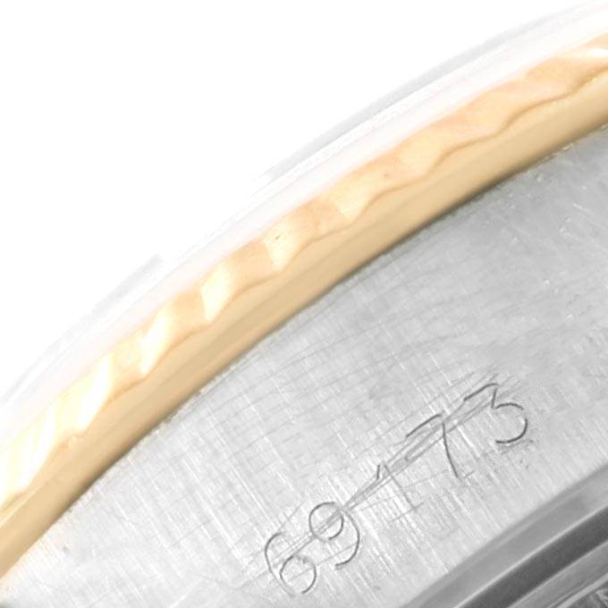 The image shows a close-up of the engraved case back of the Rolex Datejust 69173 Women's Stainless Steel White Dial 69173 Women's Stainless Steel White Dial watch, including part of the bezel.