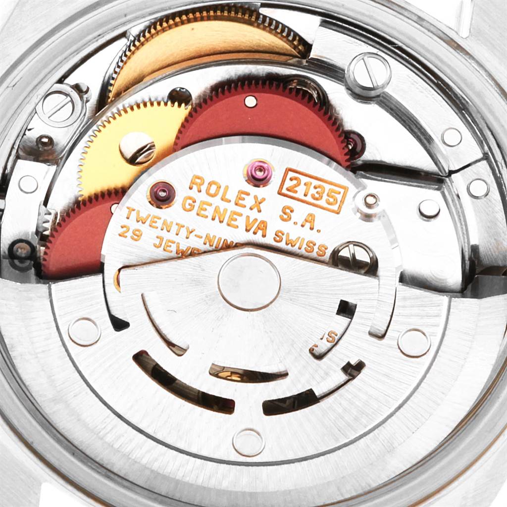 Close-up of the internal mechanism of a Rolex Datejust 69173 Women's Stainless Steel White Dial 69173 Women's Stainless Steel White Dial watch, showcasing the intricate components and engravings.