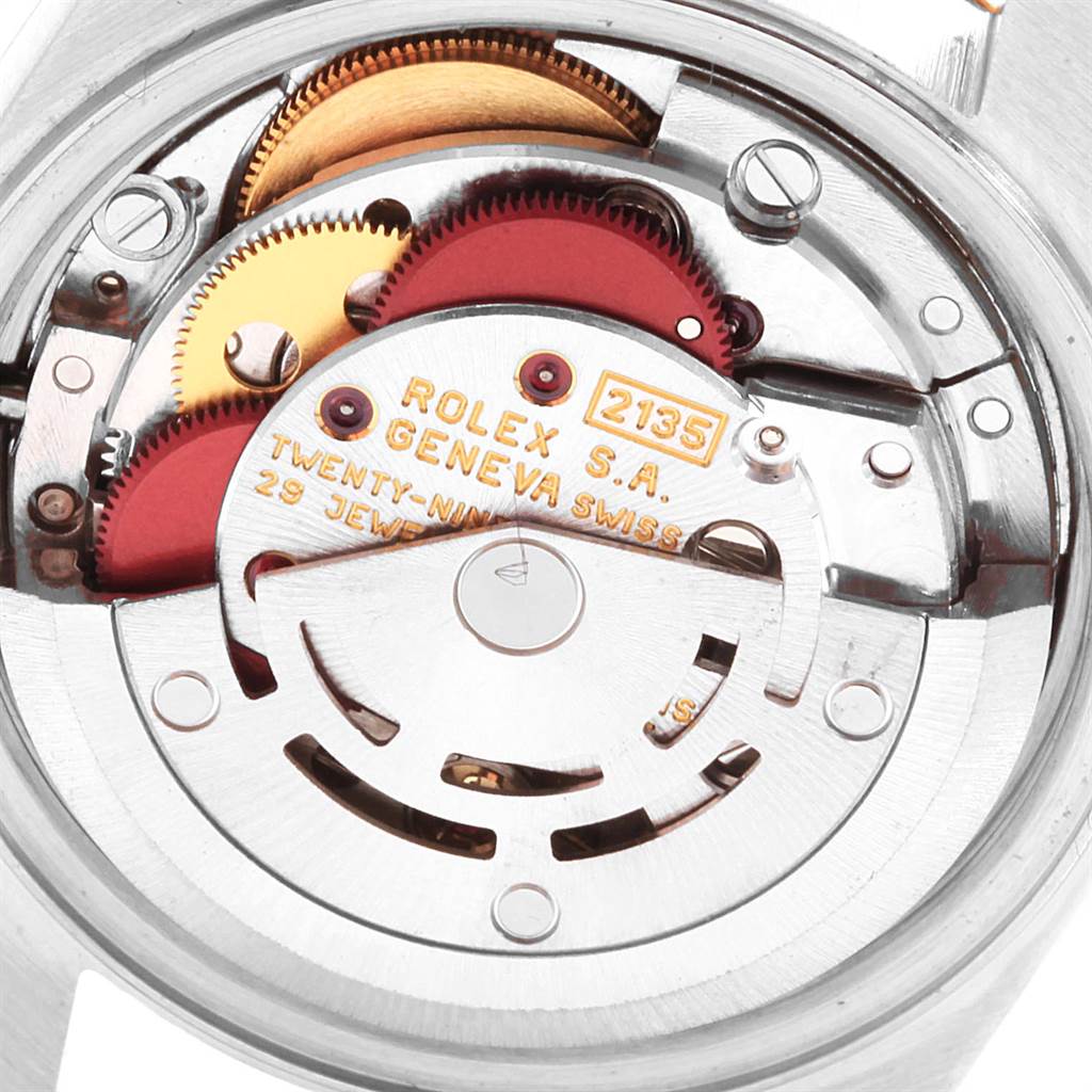 This image shows the movement mechanism of a Rolex Datejust 69173 Women's Stainless Steel Champagne Dial 69173 Women's Stainless Steel Champagne Dial watch from the back, highlighting its gears and rotor.