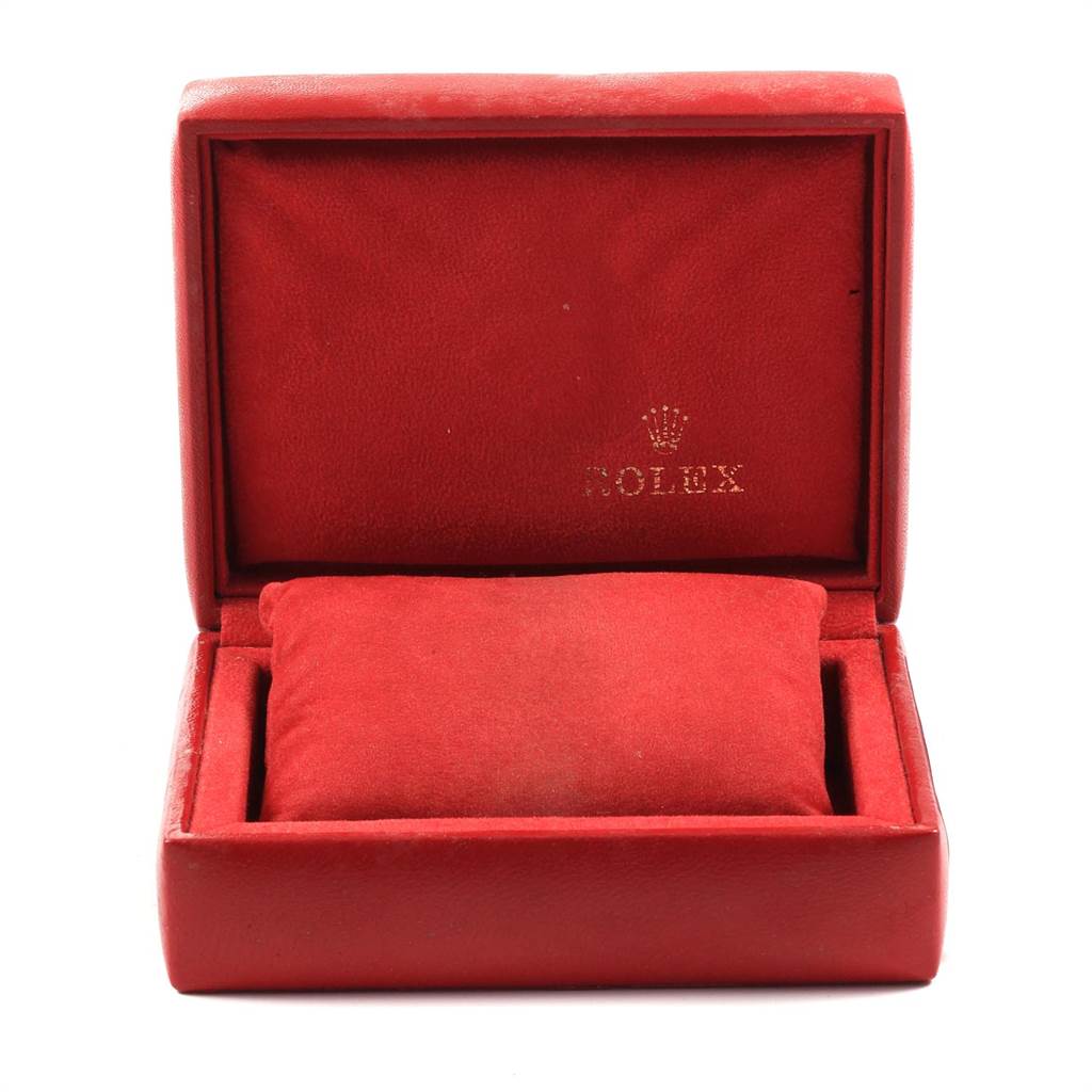 This image shows an open, empty red Rolex Datejust 69174 Women's Stainless Steel Silver Dial 69174 Women's Stainless Steel Silver Dial watch box with a cushion inside.