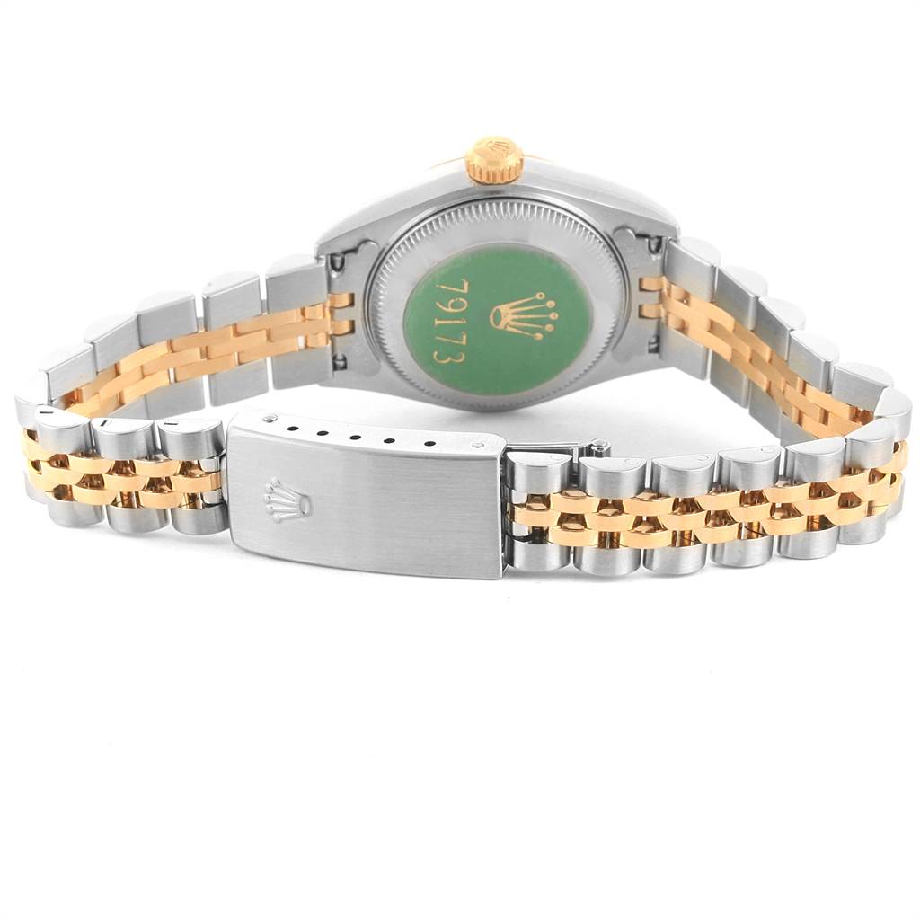 The image shows the back and bracelet of a Rolex Datejust 79173 Women
s Stainless Steel Champagne Dial 79173 Women
s Stainless Steel Champagne Dial watch with a stainless steel and gold combination.