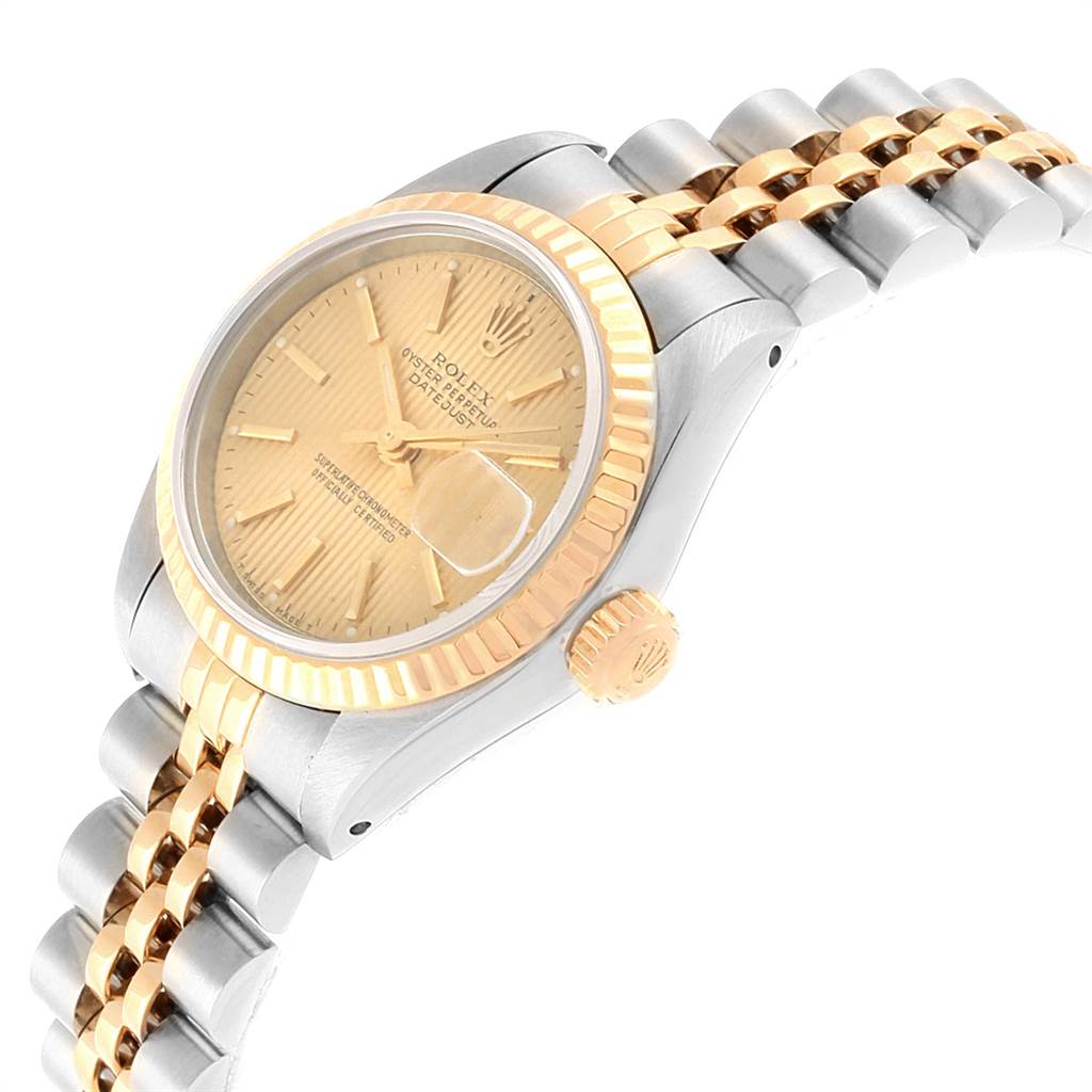 This Rolex Datejust 69173 Women's Stainless Steel Champagne Dial 69173 Women's Stainless Steel Champagne Dial watch is shown at an angled side view, highlighting its gold and silver jubilee bracelet and fluted bezel.
