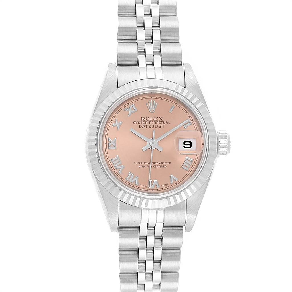 The image shows a front view of a Rolex Datejust 79174 Women
s Stainless Steel Pink Dial 79174 Women
s Stainless Steel Pink Dial watch with a rose dial, Roman numerals, and Jubilee bracelet.