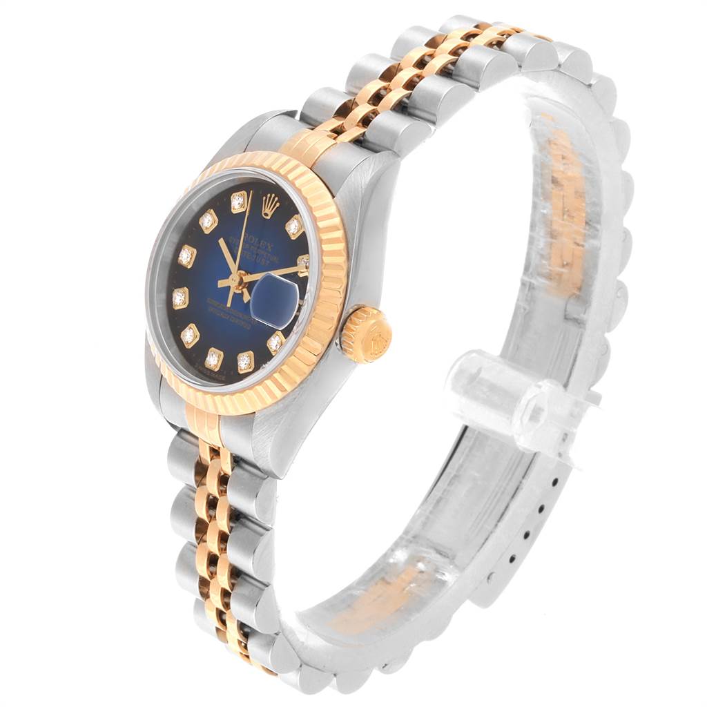 The Rolex Datejust 79173 Women's Steel and Gold (two tone) Blue Dial 79173 Women's Steel and Gold (two tone) Blue Dial watch is shown from a three-quarter angle, displaying its face, bezel, crown, and bracelet.