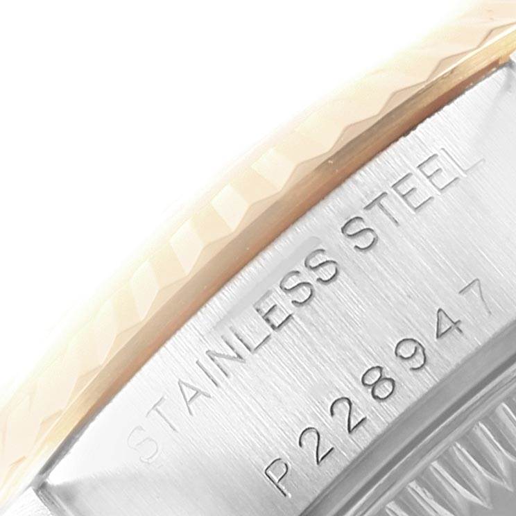 This close-up image of a Rolex Datejust 79173 Women's Steel and Gold (two tone) Blue Dial 79173 Women's Steel and Gold (two tone) Blue Dial watch shows the stainless steel case back with engravings.