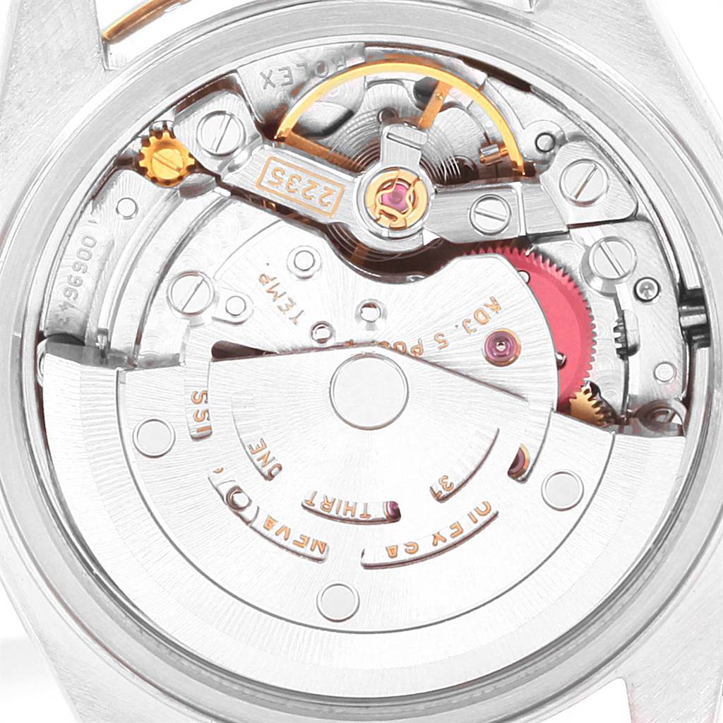 The image shows a close-up view of the movement mechanics inside a Rolex Datejust 79173 Women's Steel and Gold (two tone) Blue Dial 79173 Women's Steel and Gold (two tone) Blue Dial watch from the back.