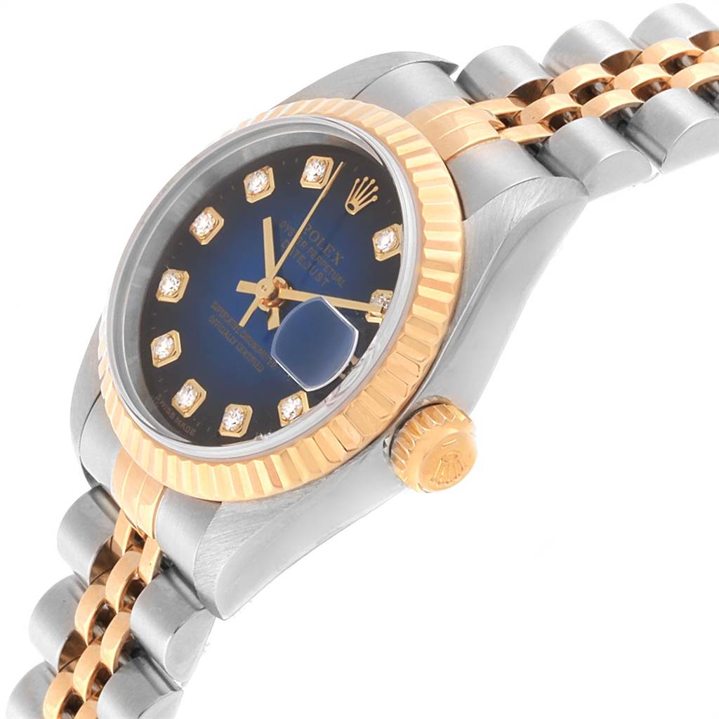 The Rolex Datejust 79173 Women's Steel and Gold (two tone) Blue Dial 79173 Women's Steel and Gold (two tone) Blue Dial watch is shown from an angled side view, highlighting the crown, bezel, and part of the bracelet.