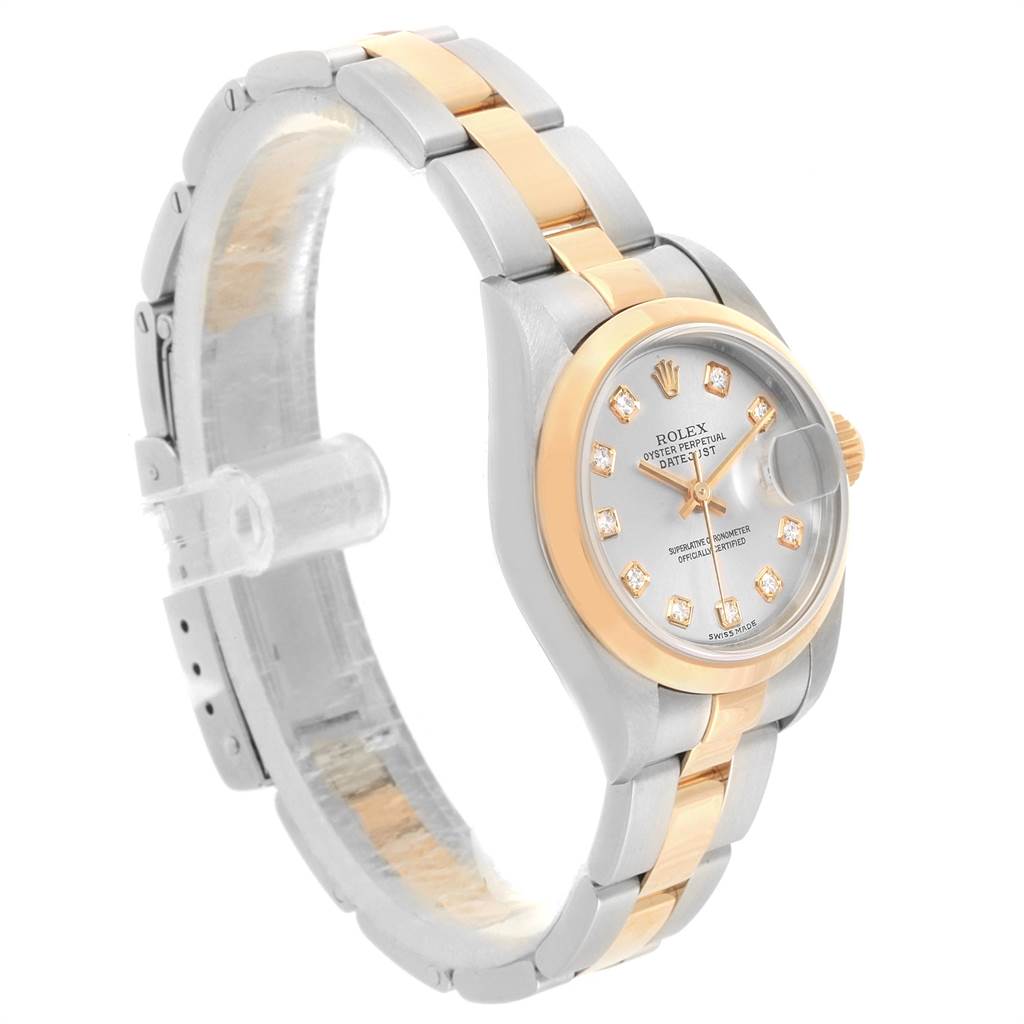 The Rolex Datejust 79163 Women's Steel and Gold (two tone) Silver Dial 79163 Women's Steel and Gold (two tone) Silver Dial watch is shown from a three-quarter angle, highlighting the bracelet, bezel, and dial with diamond hour markers.