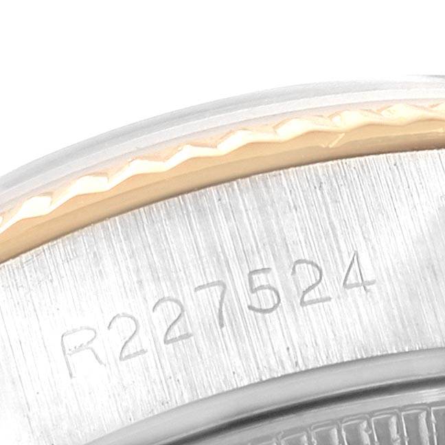 This image shows a close-up of the serial number engraved on the side case of a Rolex Datejust 69173 Women's Stainless Steel Silver Dial 69173 Women's Stainless Steel Silver Dial watch.