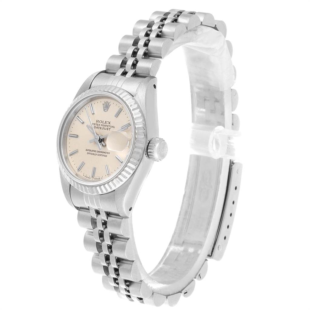 The image shows a side angle view of a Rolex Datejust 69174 Women's Stainless Steel Silver Dial 69174 Women's Stainless Steel Silver Dial watch, highlighting its dial, fluted bezel, and jubilee bracelet.