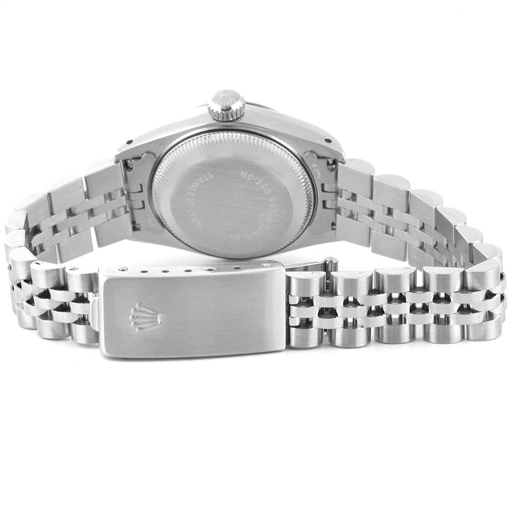 This image shows the back view of a Rolex Datejust 69174 Women's Stainless Steel Silver Dial 69174 Women's Stainless Steel Silver Dial watch, highlighting the case back, crown, and metal bracelet with the clasp open.
