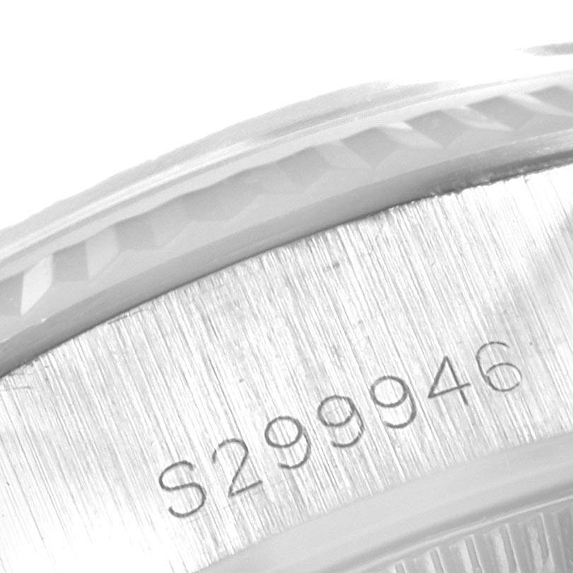 The image shows a close-up of the serial number engraved on the side of the Rolex Datejust 69174 Women's Stainless Steel Silver Dial 69174 Women's Stainless Steel Silver Dial watch case.