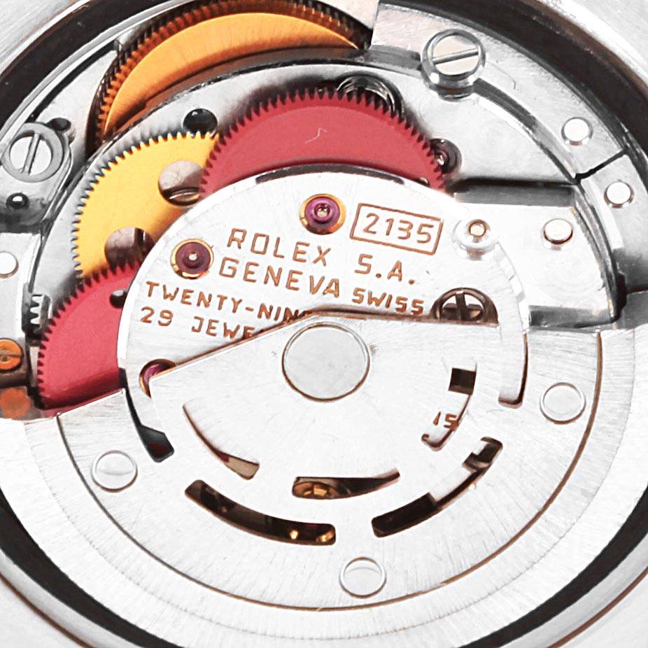 The image shows a close-up of the movement inside a Rolex Datejust 69174 Women's Stainless Steel Silver Dial 69174 Women's Stainless Steel Silver Dial watch, showcasing the gears and internal mechanics.