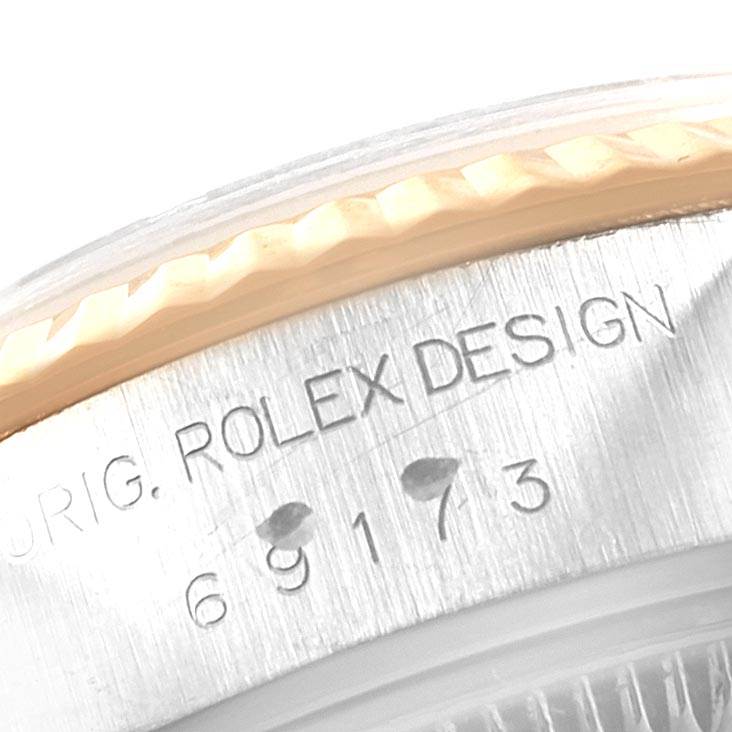 This is a close-up view showing the model number and part of the bezel of a Rolex Datejust 69173 Women's Steel and Gold (two tone) Blue Dial 69173 Women's Steel and Gold (two tone) Blue Dial watch.