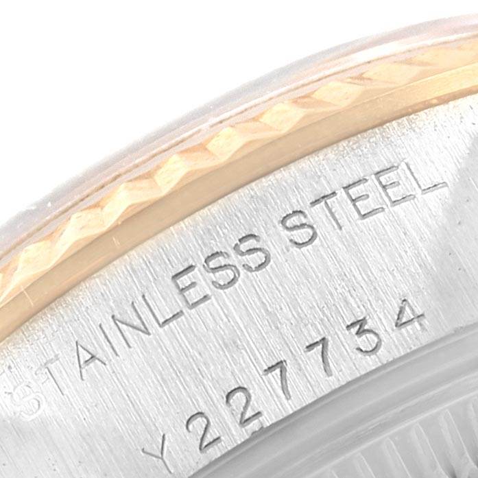 This close-up image shows the case side of a Datejust model by Rolex, highlighting its stainless steel construction and serial number.