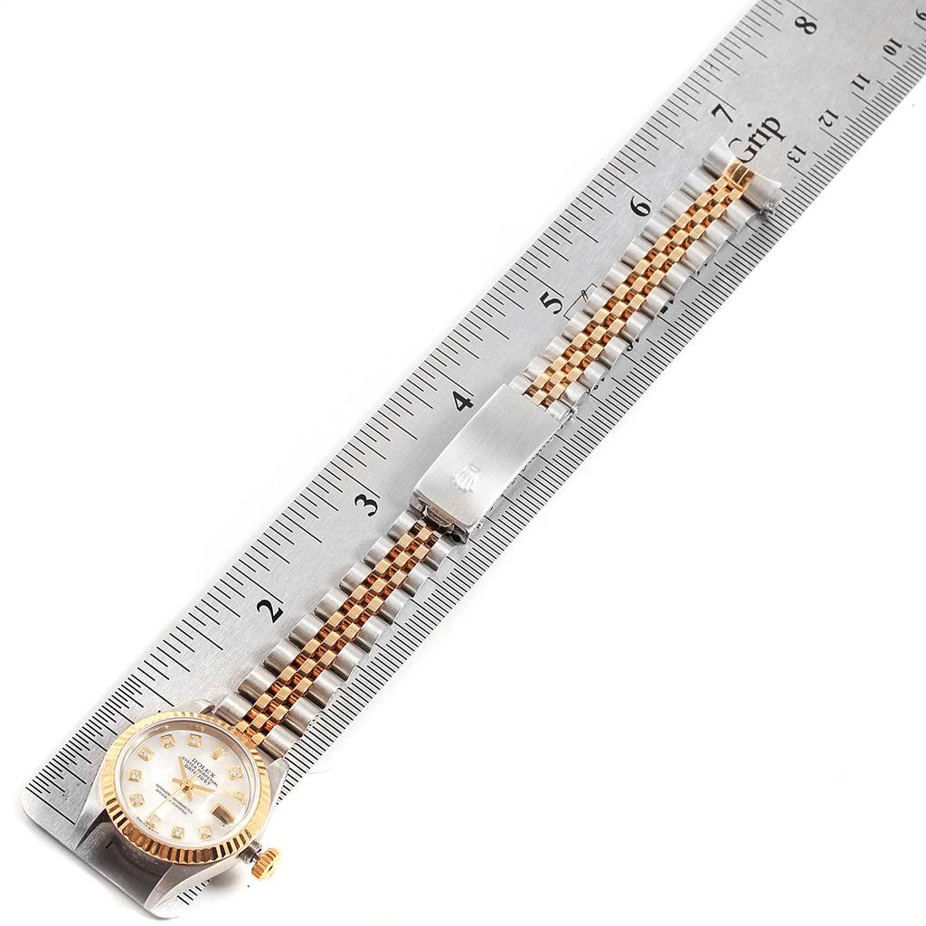 The image shows a Rolex Datejust 79173 Women's Stainless Steel Mother of Pearl Dial 79173 Women's Stainless Steel Mother of Pearl Dial watch lying flat alongside a ruler, highlighting the watch head and part of the bracelet.