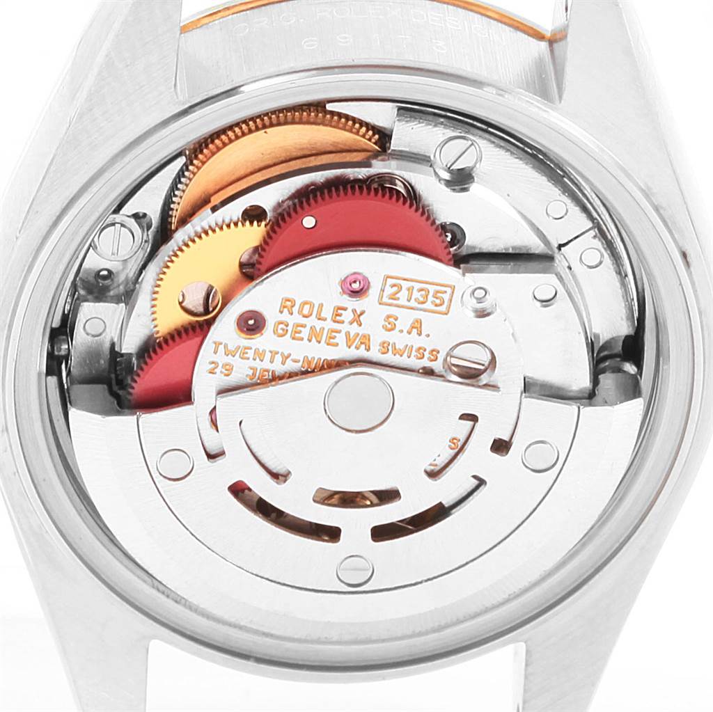 The image shows the back of a Rolex Datejust 69173 Women's Stainless Steel White Dial 69173 Women's Stainless Steel White Dial watch, revealing its internal mechanical movement.