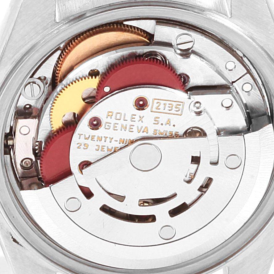 This image shows the internal movement mechanism of the Rolex Datejust 69173 Women's Stainless Steel Black Dial 69173 Women's Stainless Steel Black Dial watch, featuring gears and the rotor.