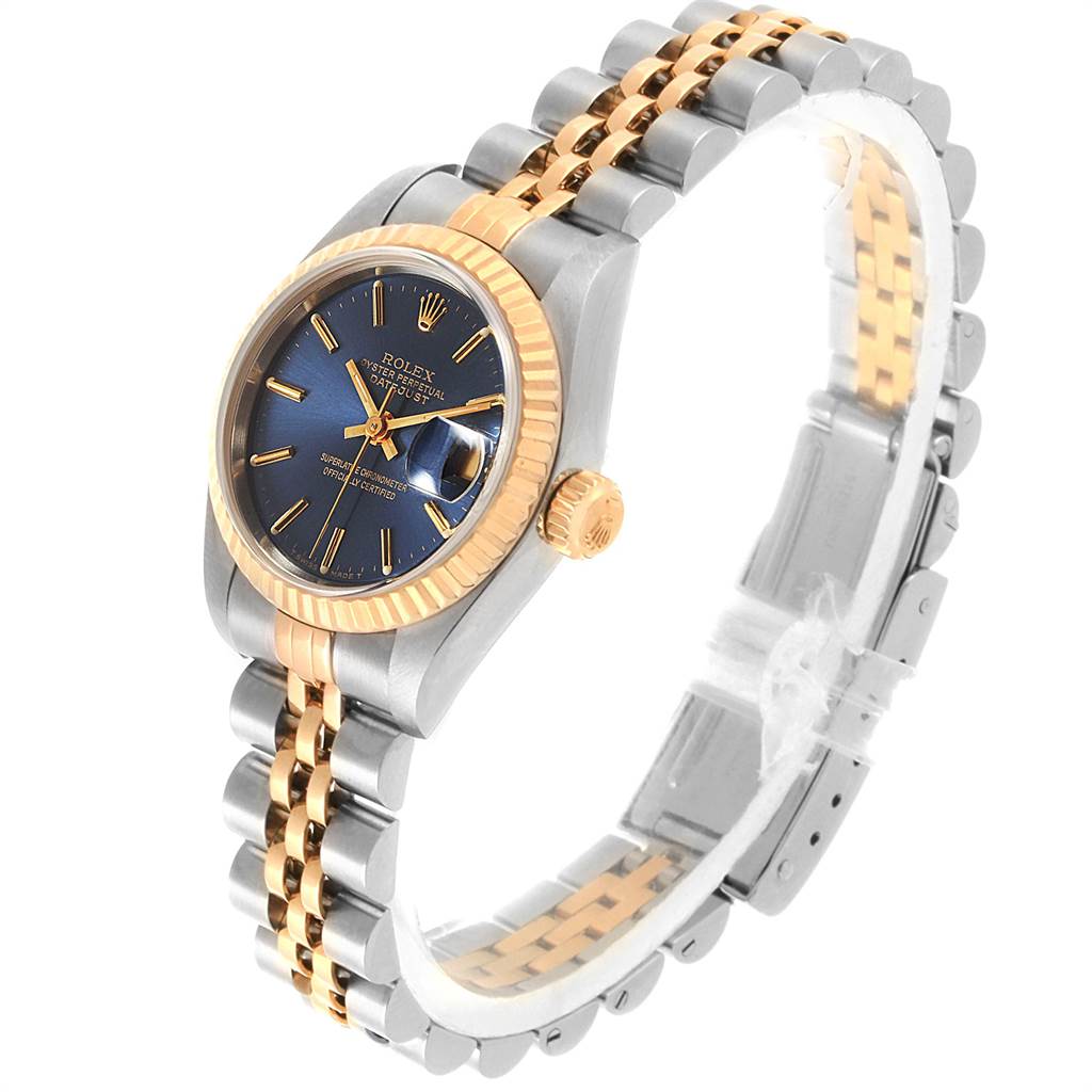 The Rolex Datejust 69173 Women's Stainless Steel Blue Dial 69173 Women's Stainless Steel Blue Dial watch is shown at a three-quarter angle, highlighting the face, fluted bezel, crown, and two-tone bracelet.