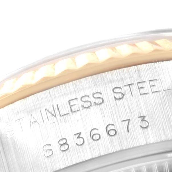This image shows a close-up of the stainless steel bezel and serial number on a Rolex Datejust 69173 Women's Stainless Steel Blue Dial 69173 Women's Stainless Steel Blue Dial watch.
