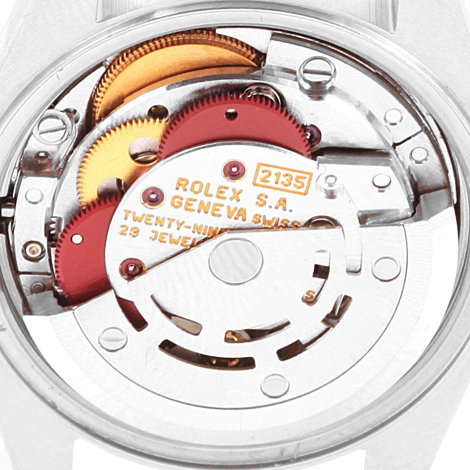 This image shows the internal mechanism of a Rolex Datejust 69173 Women's Stainless Steel Blue Dial 69173 Women's Stainless Steel Blue Dial watch from a rear angle, highlighting the movement and gears.