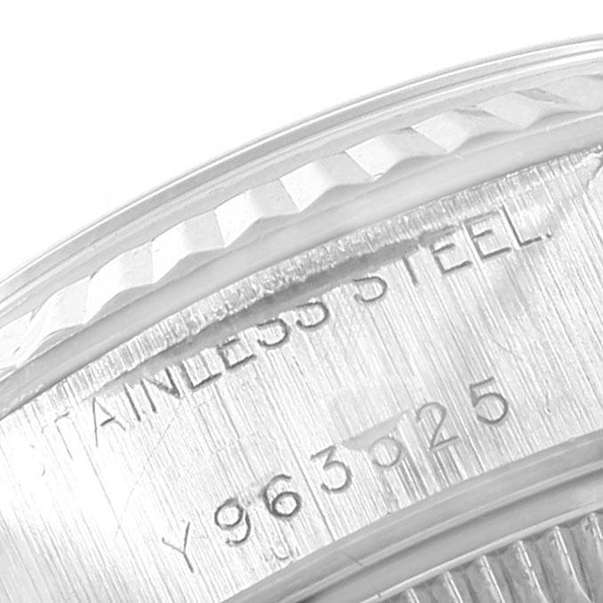 The image shows a close-up of the fluted bezel and part of the inner case, displaying the stainless steel engraving of a Rolex Datejust 79174 Women's Stainless Steel Mother of Pearl Dial 79174 Women's Stainless Steel Mother of Pearl Dial.