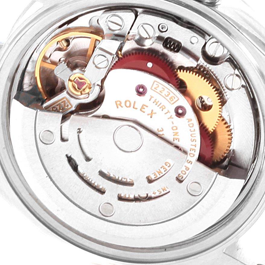 The image shows the internal mechanism of the Rolex Datejust 79174 Women's Stainless Steel Silver Dial 79174 Women's Stainless Steel Silver Dial watch, highlighting gears and intricate components.