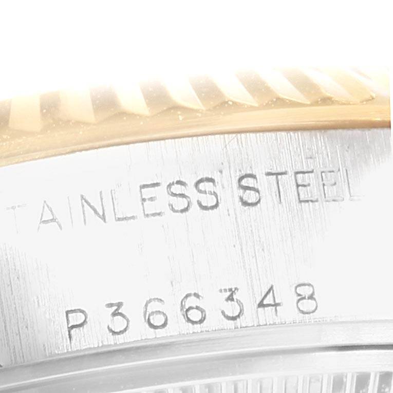 This close-up shows the stainless steel casing and part of the fluted bezel of a Rolex Datejust 79173 Women's Stainless Steel Champagne Dial 79173 Women's Stainless Steel Champagne Dial watch, along with the model number.